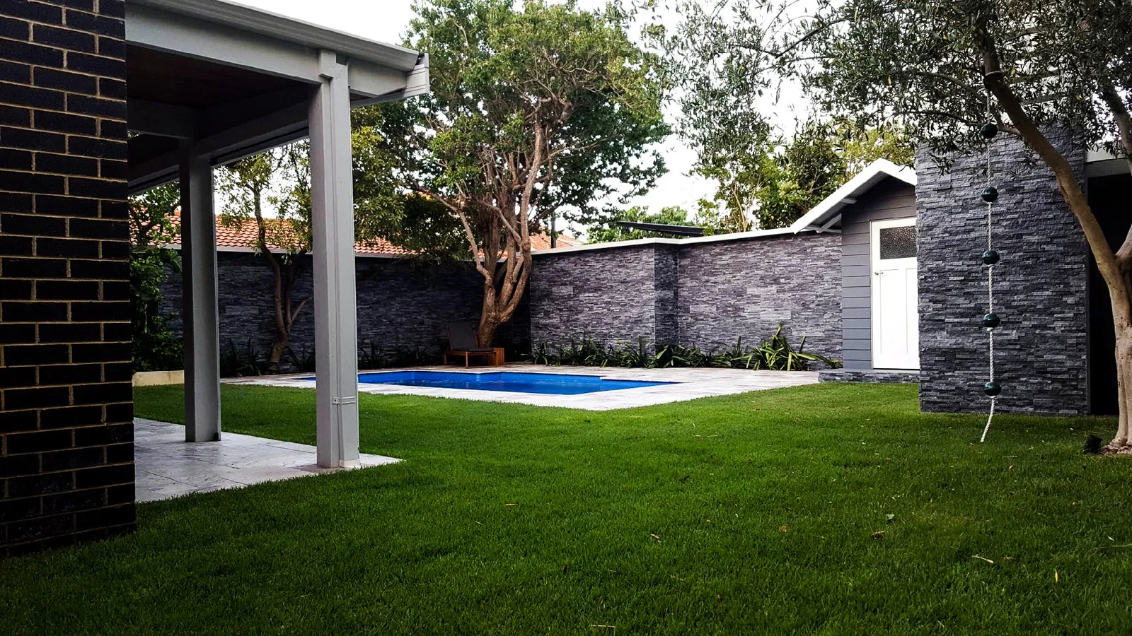 The finished pool cabana from the garden