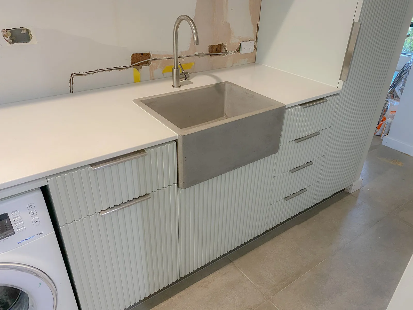 Fluted laundry, farmhouse sink