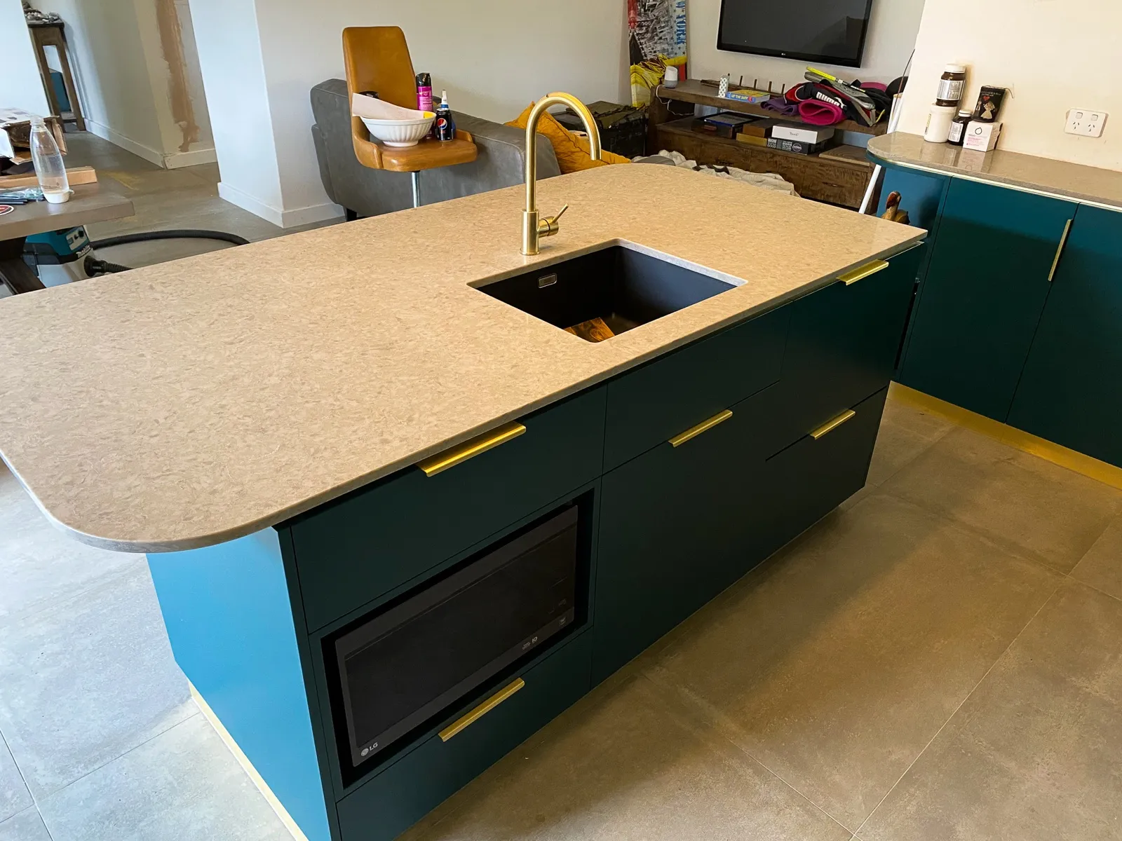 Teal island, brass tapware