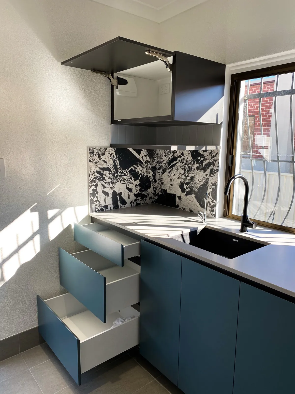 Slate blue laundry, lift-up overheads